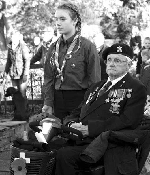 The late World War II veteran Jim Newstead, with Isla Harrison from Keswick Scouts during last year's Remembrance Day