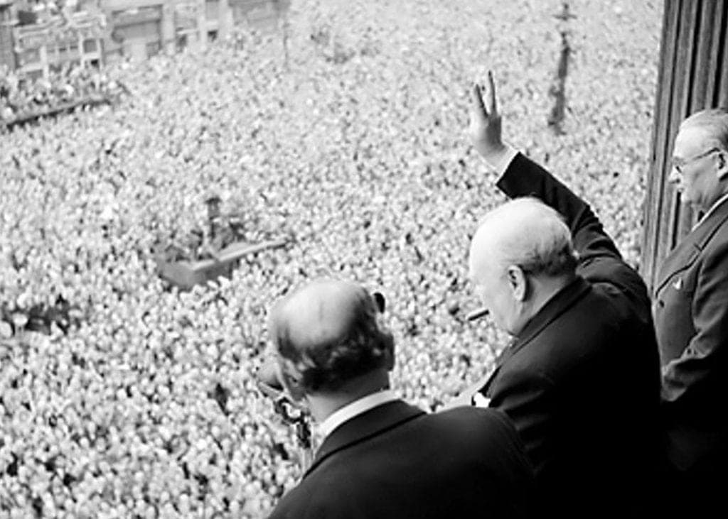 Winston Churchill Waves to Crowd After VE Day, End of War in Europe. Photo by Public Domain.