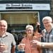 HOLD THE FRONT PAGE Andy Barr (left) toasts the future of the Keswick Reminder with former owners Jane Grave and David Branthwaite.