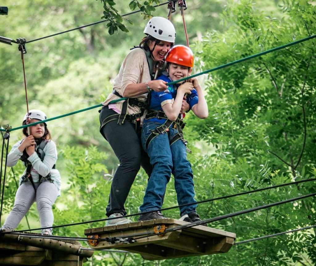 Oliver Voysey supported by mum Sarah and watched over by sister Elizabeth, aces the Calvert Lakes high ropes course