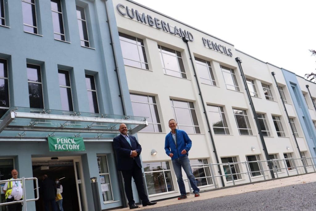 Workington MP Mark Jenkinson and David Sawday, chief operating officer of Keswick Ministries  outside the pencil factory