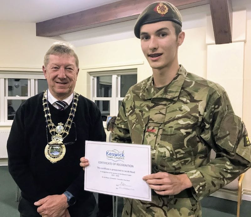 Mayor Alan Dunn presenting a certificate to young cadet Jacob Head